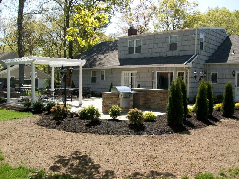 backyard patio design with bbq island and pergola